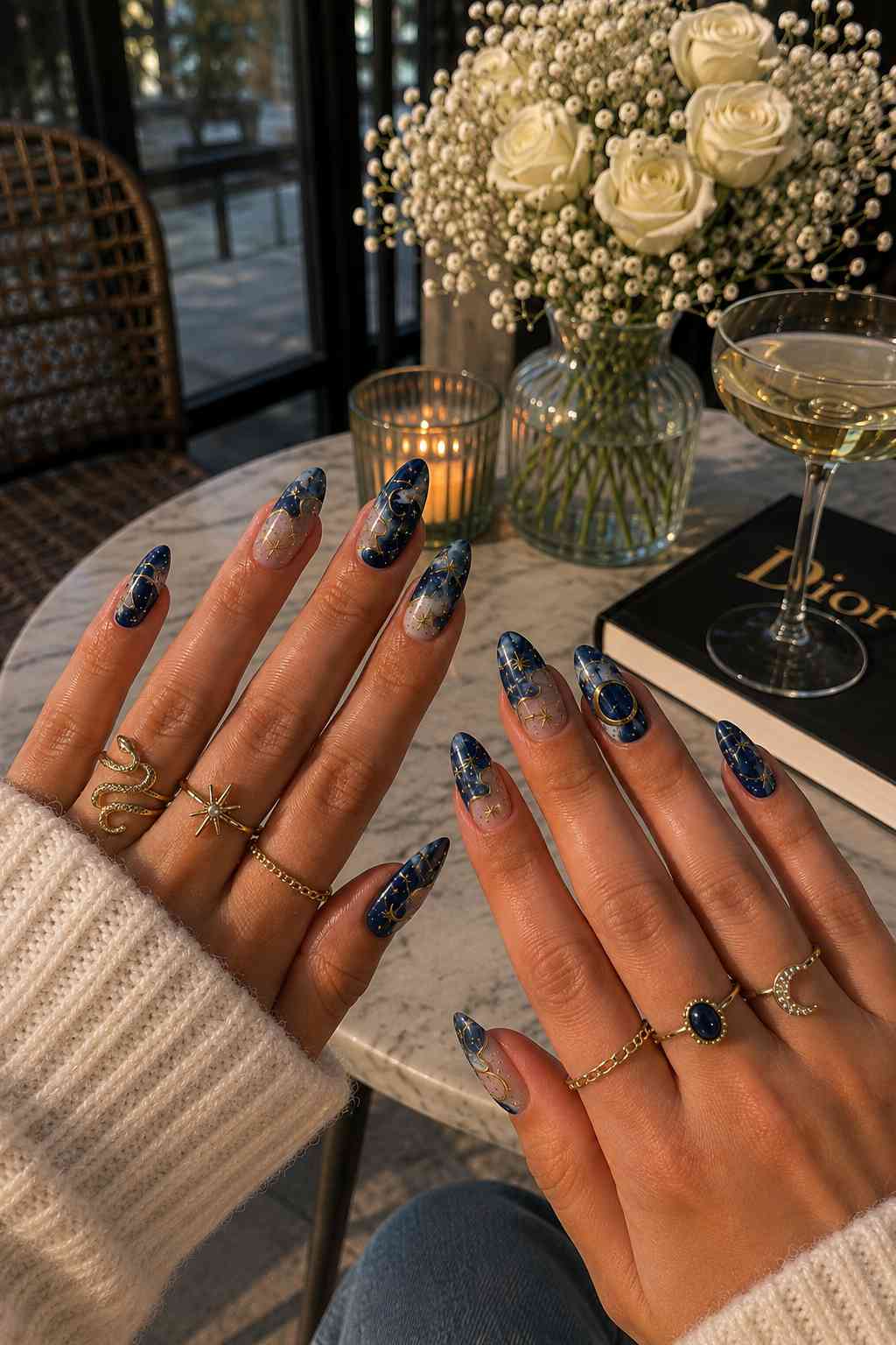 Indigo watercolor nail art with gold star and moon line detailing
