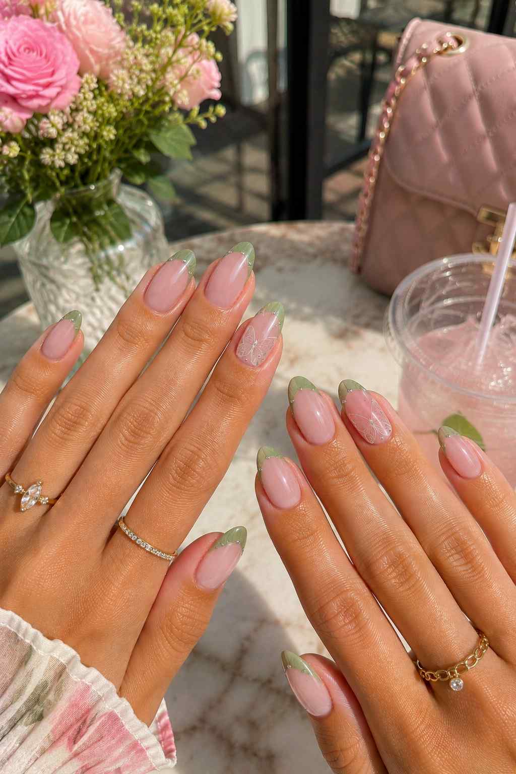 Shimmery green French tips with silver butterfly line art