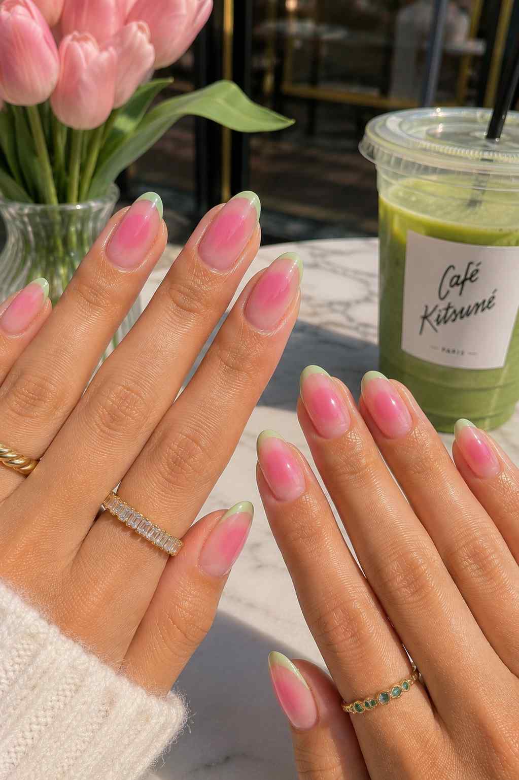 Green tip nails with a blurred pink ombre center