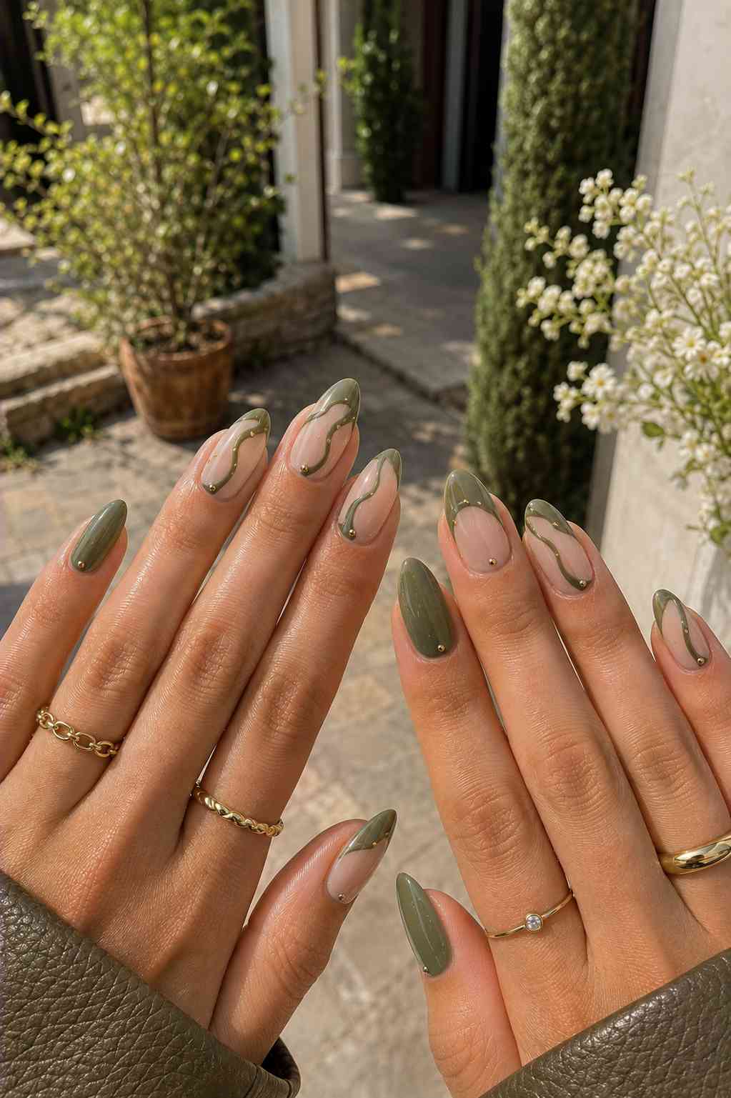 Sheer and olive nails joined by a continuous gold swirl line dotted with small gold beads