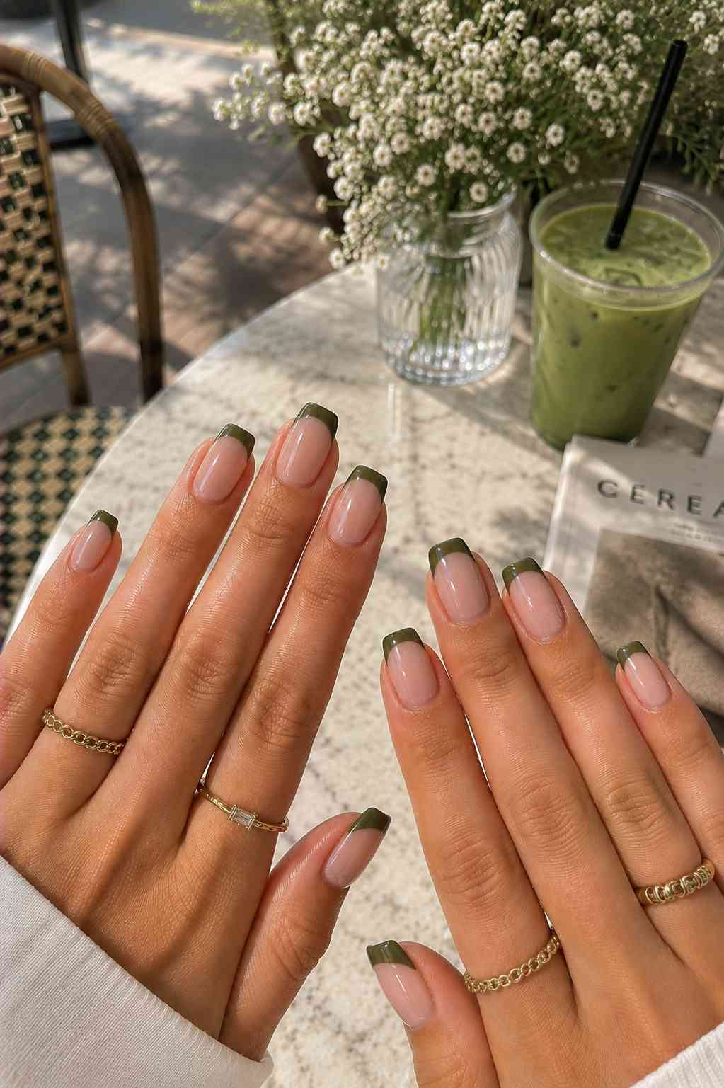 Clean square nails with an olive green reverse French tip manicure