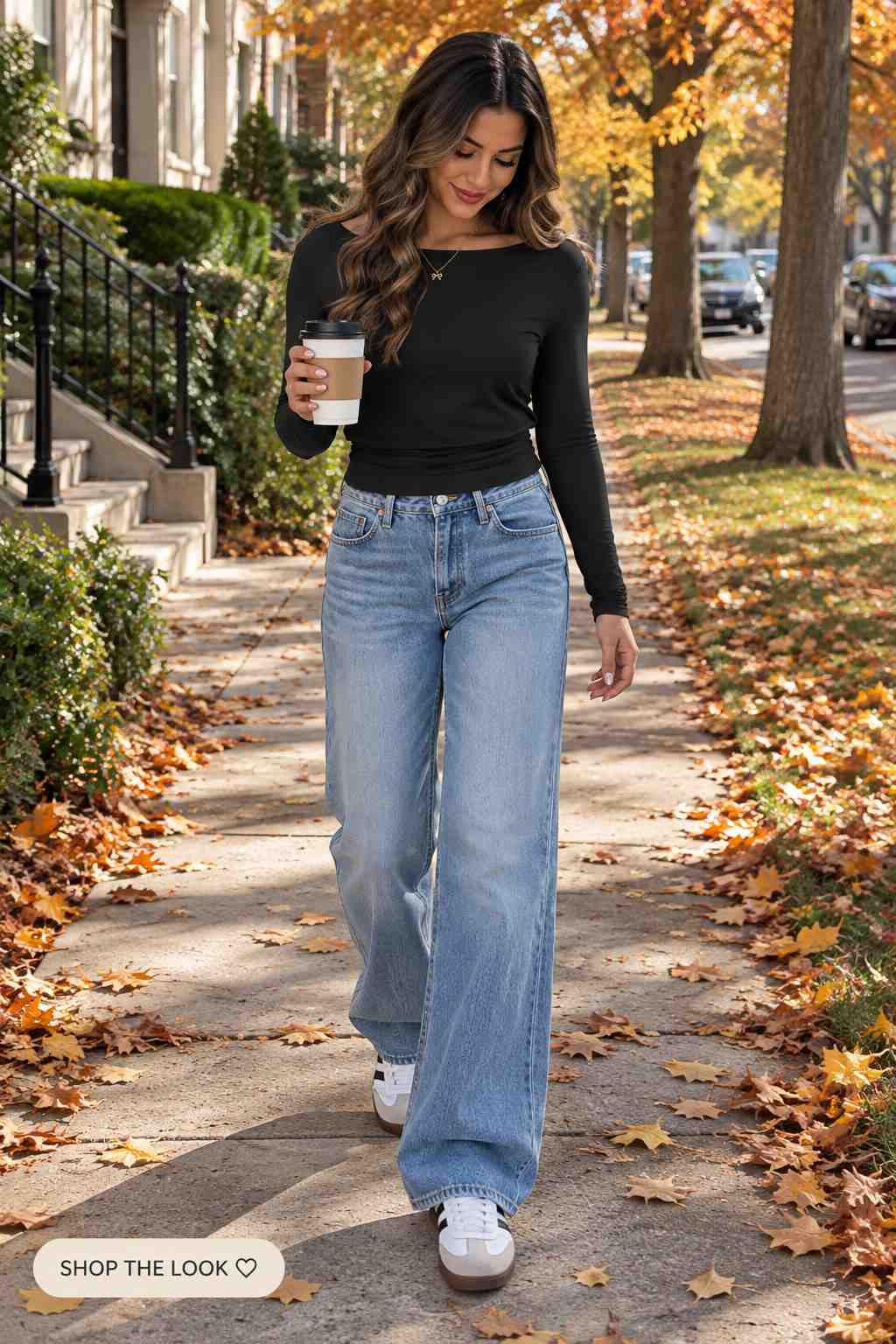 Black long sleeve top with wide-leg jeans and white sneakers