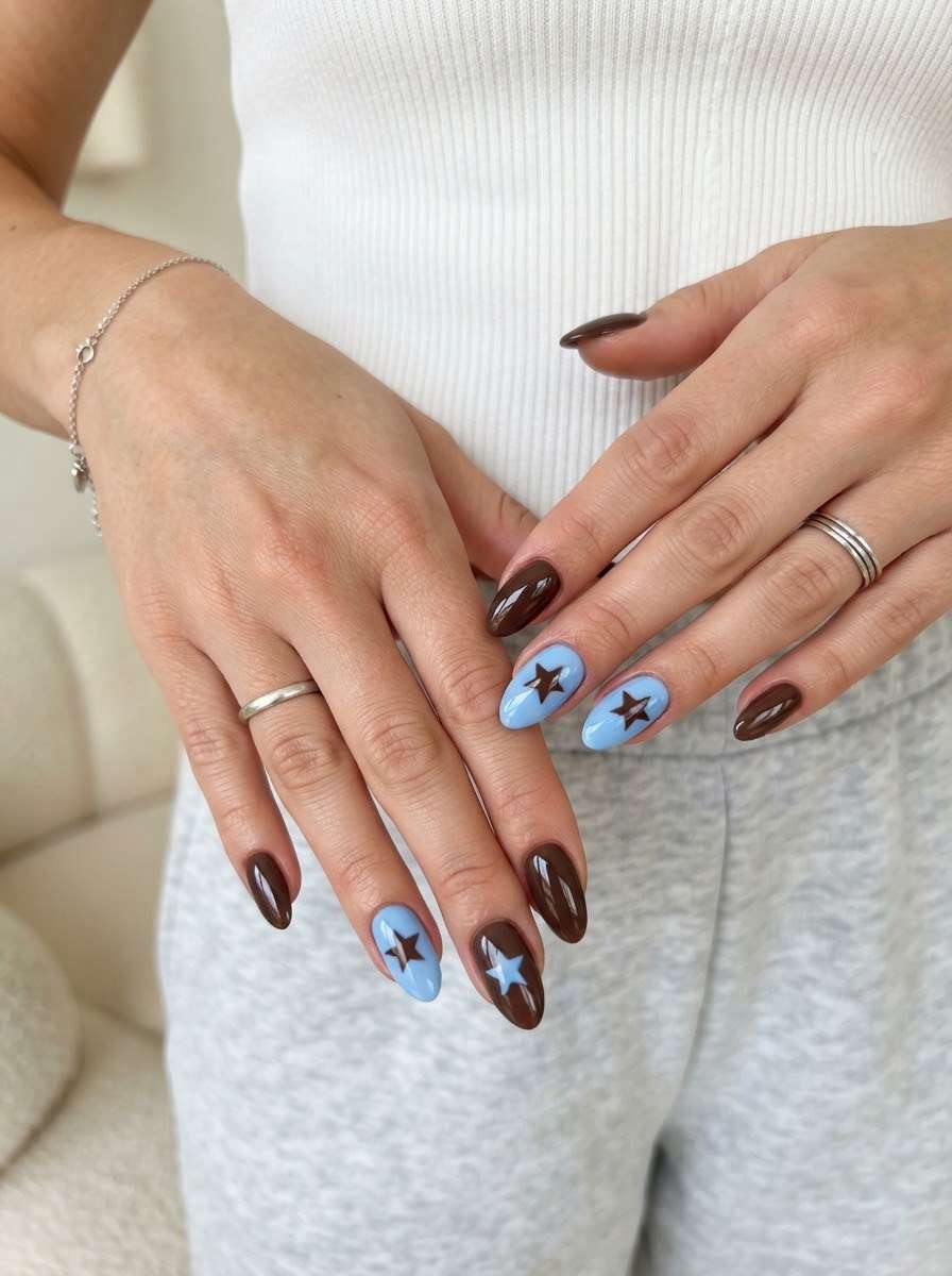 Brown nails with blue star accent nails