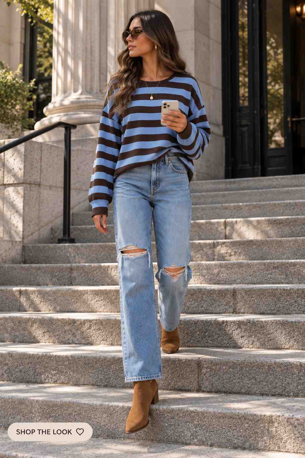 Brown and blue striped sweater with ripped jeans and suede ankle boots