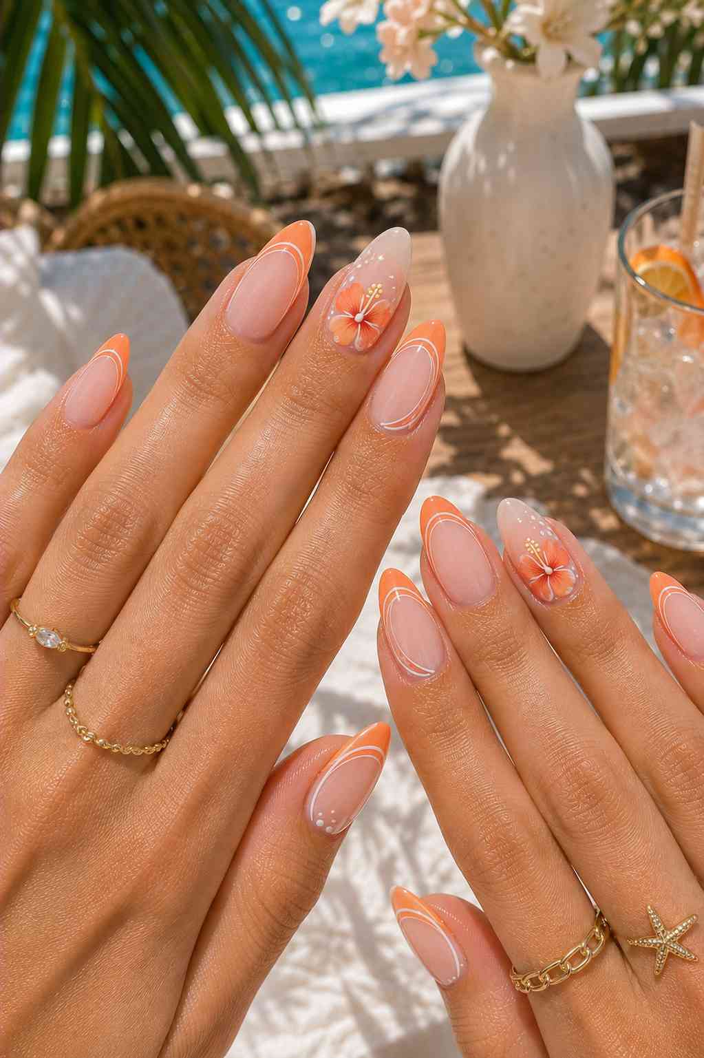 Coral and white swirled line art nails with white daisy flowers featuring orange centers