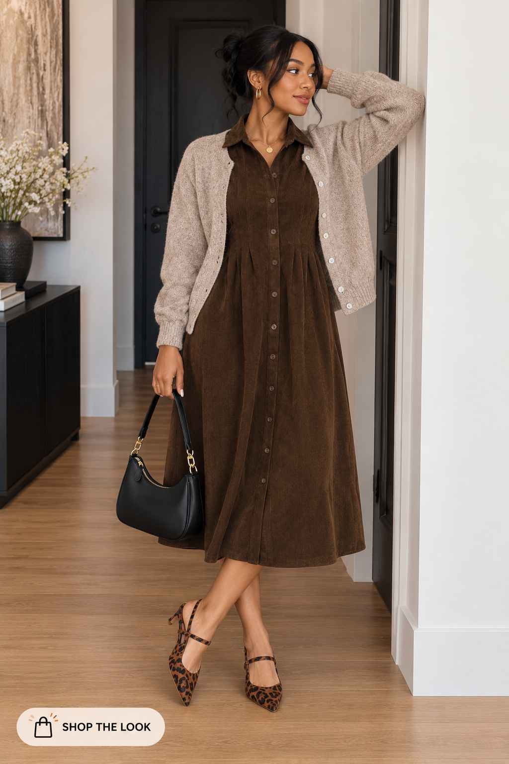 Brown corduroy button-up shirt dress layered with a beige knit cardigan and leopard heels