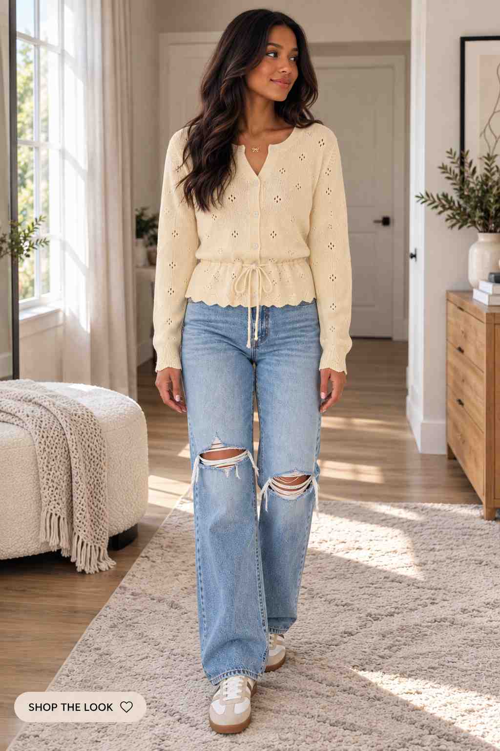 Cream crochet cardigan with drawstring waist and distressed wide-leg jeans