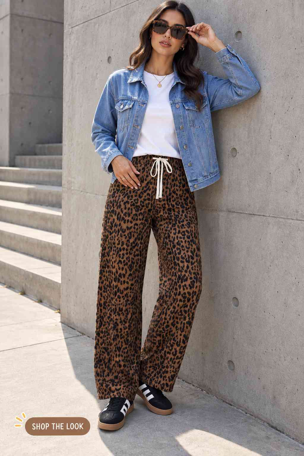 Oversized denim jacket with a white tee and leopard print wide-leg pants
