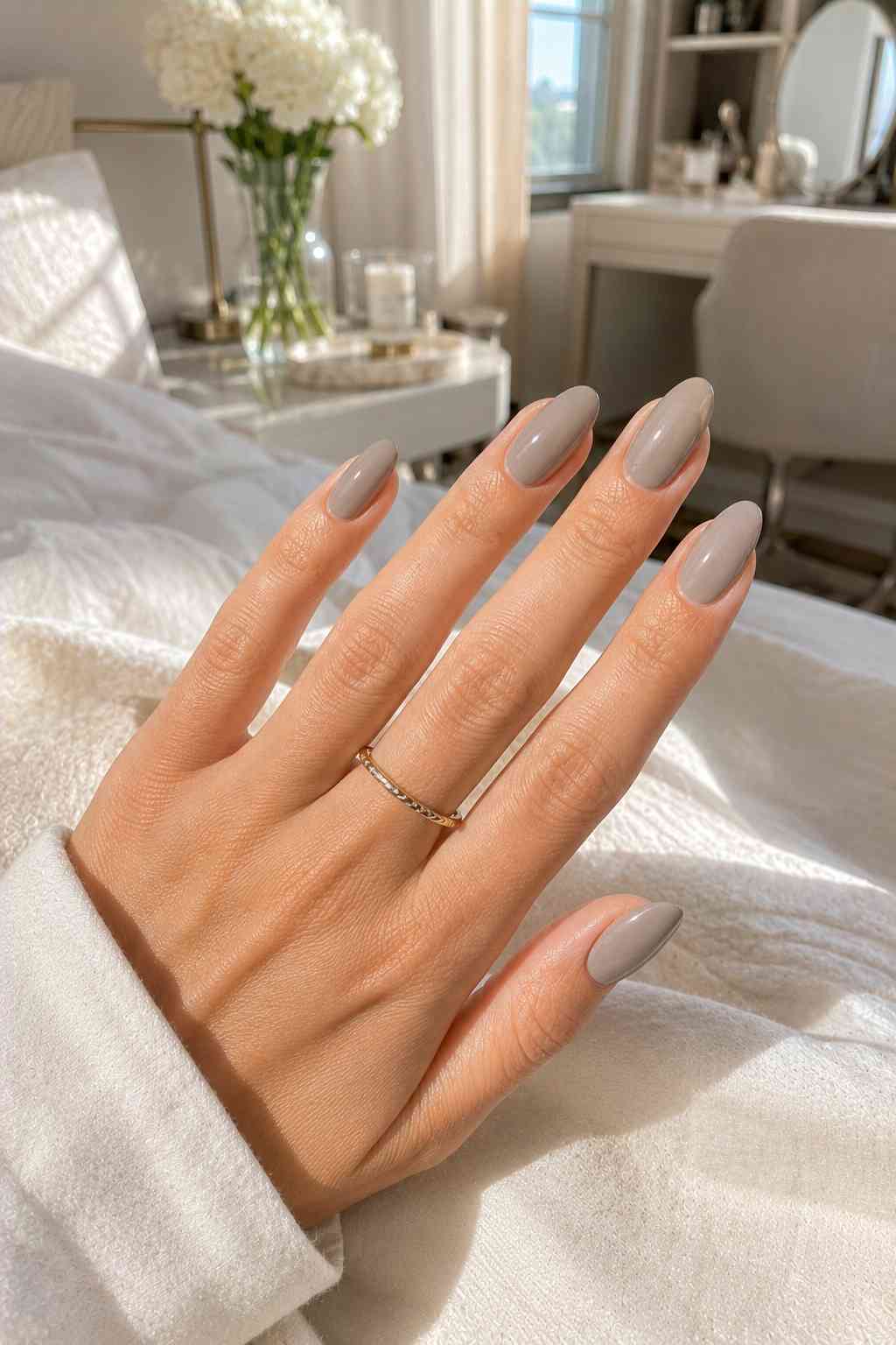 Solid milky taupe nails with a smooth glossy finish